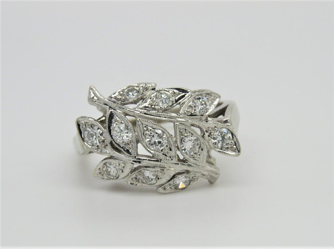 10K White Gold Art Nouveau Leaf Diamond Ring: 10K white gold Art nouveau leaf design diamond ring. Milgrain pattern on stems and leaves. Approximately 0.55 cts total diamond weight in eleven round diamonds. Ring size 8. Weighs 4.2 grams.