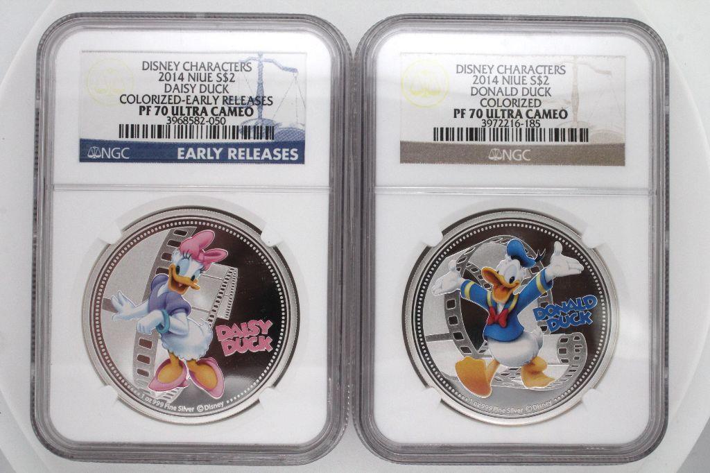 2014 NIUE SILVER $2 DISNEY Donald and Daisy Duck: 2 coins. 2014 Niue silver $2 Disney. Featuring Daffy & Daisy Duck. They are colorized and graded by NGC PF70 Ultra Cameo.