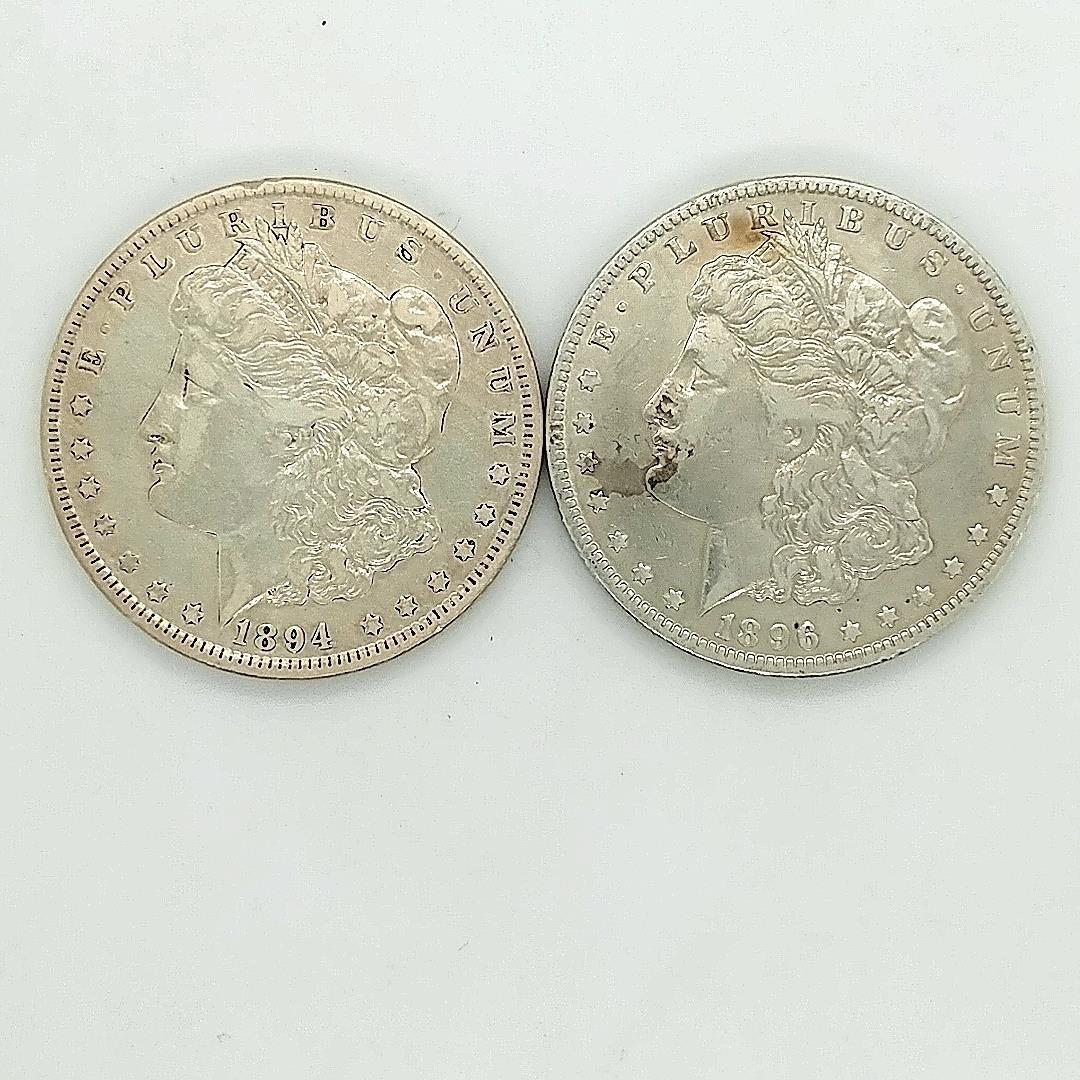 1894-O and 1986-O Morgan Silver Dollars XF: 2 coins 1894-O and 1986-O Morgan Silver Dollars in XF condition. A pair of better date Morgan Silver Dollars. great coins for a set.