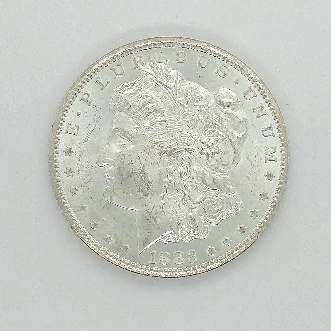 1883 CC Morgan Silver Dollar Choice Unc.: A 1883 CC Morgan Silver Dollar Choice Uncirculated condition. Full strike and frosty white mint luster. A nice coin for a Morgan Dollar Set.