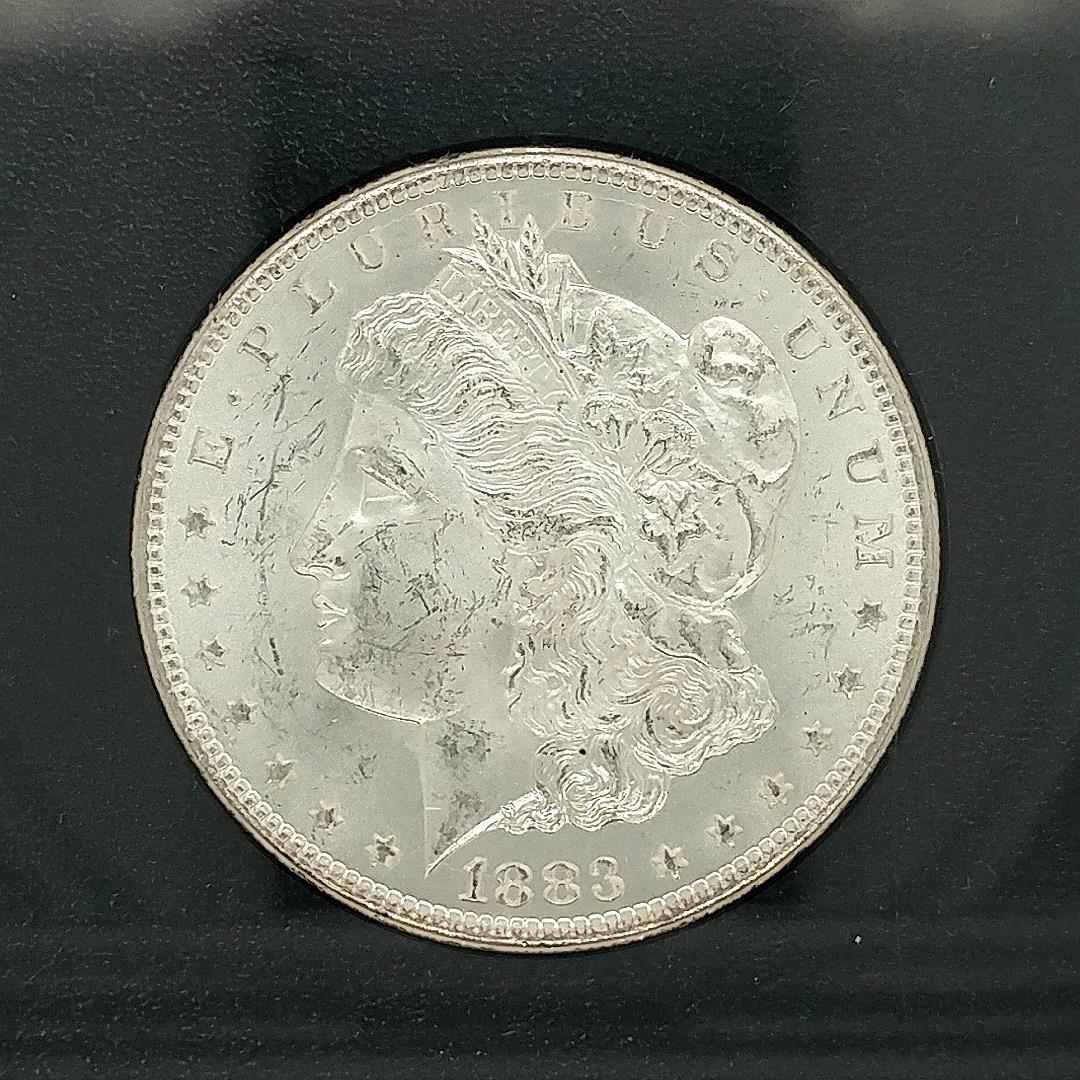 1883 CC Morgan Silver Dollar GSA with Box/COA: A gem Uncirculated 1883 CC Morgan Silver Dollar GSA with Box and COA. A very nice coin with all the GSA items.