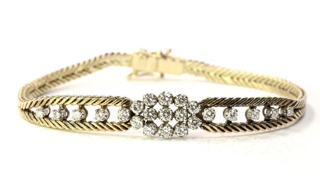 14K Yellow Gold Foxtail Diamond Bracelet: 14K Yellow Gold Foxtail bracelet set with 23 round diamonds for approximately 1.25ctw. 7" with double safety clips in a hidden box clasp. Approximately 9.5mm wide. Weighs 14.3g. This is a preowned est