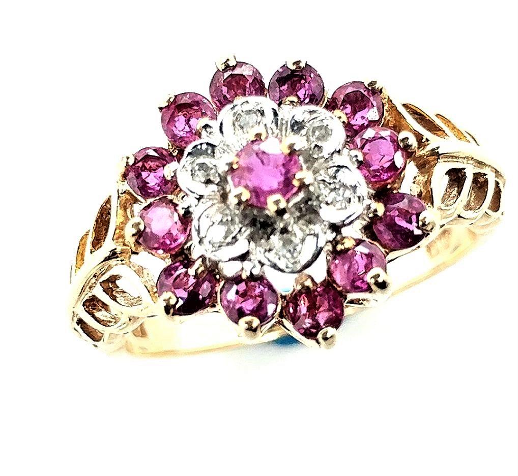 10K Yellow Gold Vintage Diamond and Ruby Ring: Vintage 10K Yellow Gold Ruby and Diamond Cluster Ring, with approximately 1.3ctw in rubies and .03ctw in diamonds.The ring is size 7.25 and weighs 3.6 grams. This is a preowned estate item.