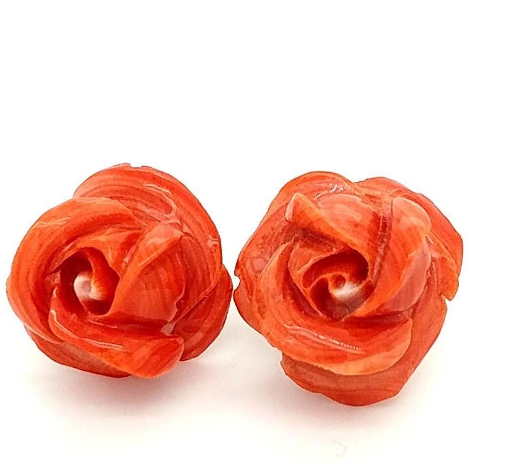 Antique 14K Rose Carved Coral Earrings: Breath taking hand carved coral earrings with 14K yellow gold lever backs. It weighs 8.0 grams. 17.3 mm and 17.5 mm. This is a preowned, estate item.