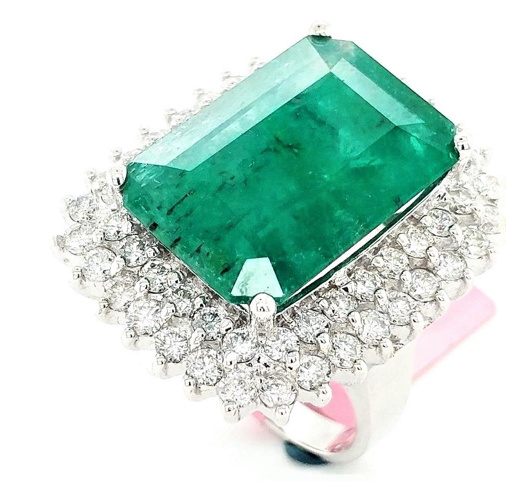 Certified 14K WG Emerald and Diamond Ring: Certified and appraised 14KT white gold 14.43ct natural, emerald-cut Emerald ring with a 2.8ctw round, brilliant-cut, G, SI1/2 diamond halo. The A quality emerald measures 19.80mm x 13.50mm. The ring 