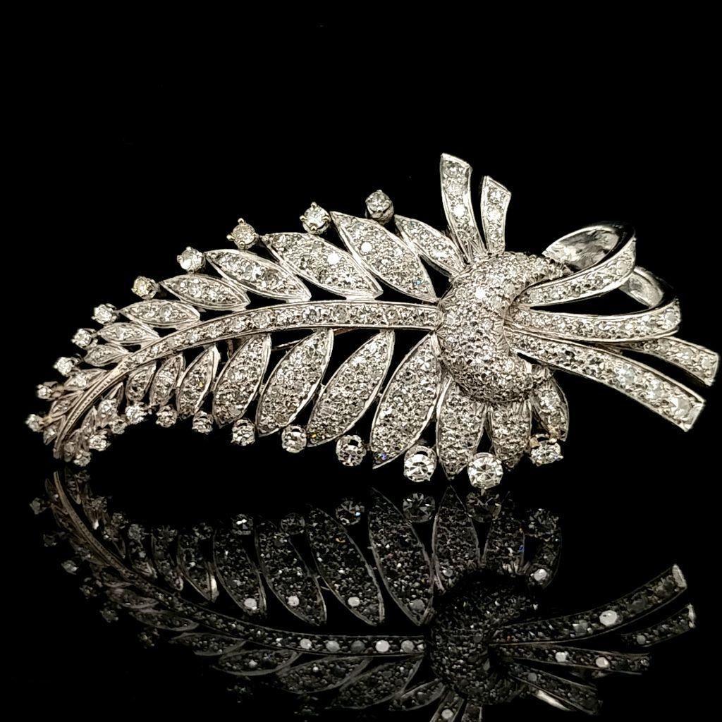 Platinum and Diamond Edwardian Feather Brooch: Platinum edwardian feather brooch set with apx 4.5ct tdw; This exquisite Pin weighs 22 grams. This pin measures 74.85 mm long x 36.30 mm wide. Forced estate liquidation item.