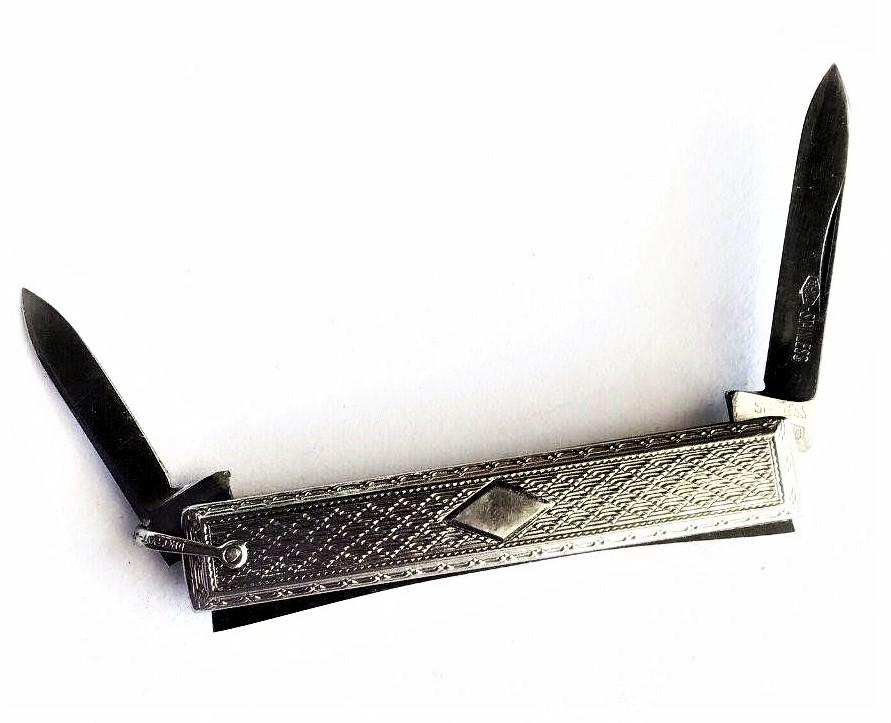 Art Deco 10k White Gold Pocket Knife Watch Fob: Pocket watch fob knife! This unique knife is signed by manufacturer on its stainless steel blade. The knife is double bladed. Itâ€™s also stamped 10k PAT July 20 1915. It displays intricate art d