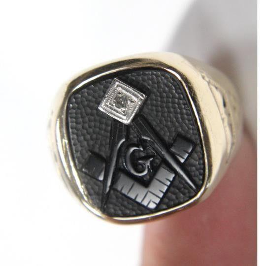 10k Gold Carved Onyx & Diamond Masonic Mens Ring: Antique Masonic ring, hand-carved black onyx with a diamond accent! The ring is a size 8.5 and weighs 6.5 grams. The ring is from the 1920s era and has hand-engraving on the sides! Small chip n one si