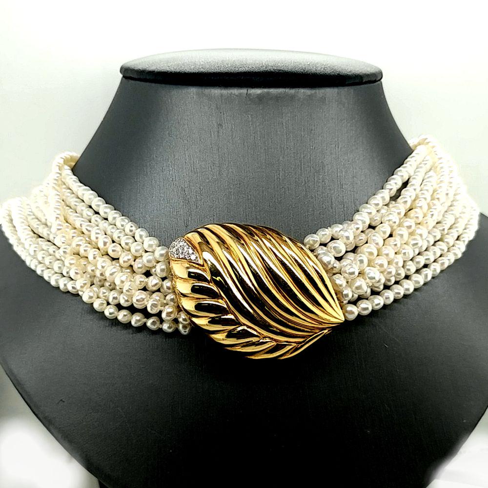 14K Gold Pearl Necklace with Diamond Clasp: This is a vintage 10-strand baroque pearls with a 14 karat yellow gold and diamond clasp that can be removed and worn as a brooch!! The strand (including brooch/clasp) is 18" long. The pearls are