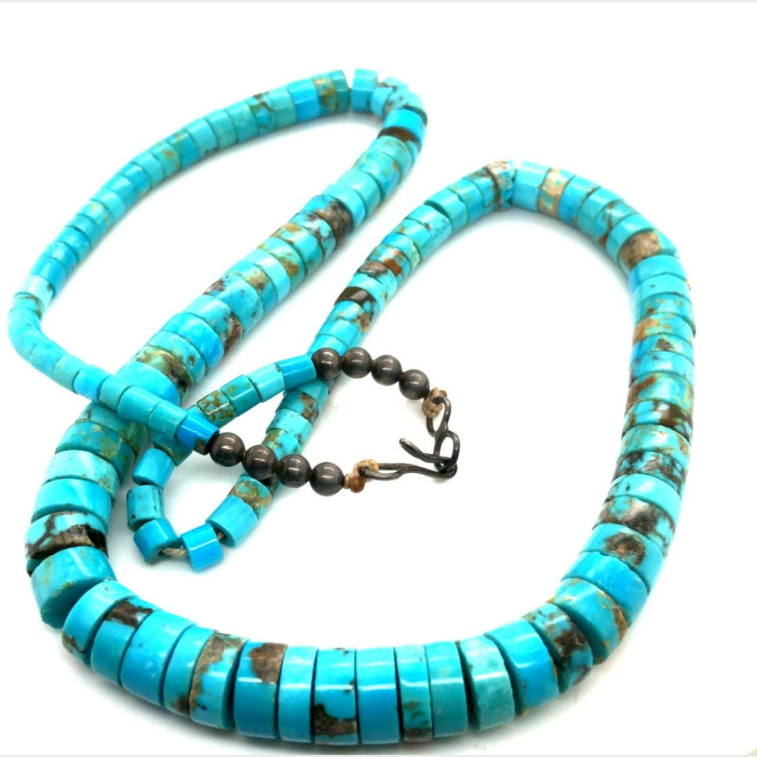 Vintage Navajo Sleeping Beauty Turquoise Necklace: Amazing Navajo Natural AAA sleeping beauty turquoise Heishi bead handmade graduated from 8mm to 3mm OAL 20" sterling silver clasp and cones