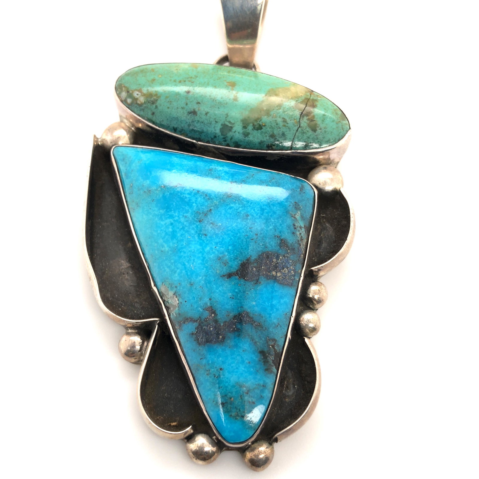 Navajo Chimney Butte Large Turquoise Pendant: Rare vintage Chimney Butte Large Turquoise shadow box design with bothAAA Kingman turquoise & AAACarico Lake turquoise sterling silver Pendant L 2 1/4 "x W 1 5/8 " H 1/4" oxidized Bail 1/2"