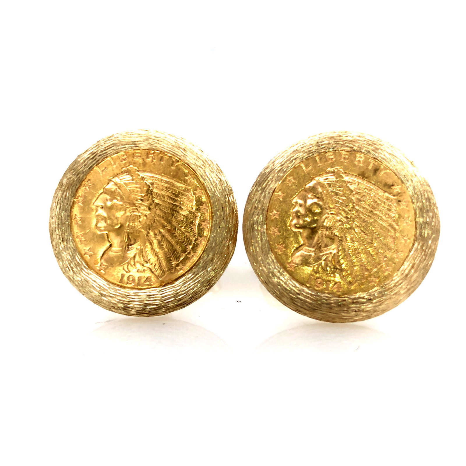 $2.5 Gold Coin Cufflinks: This is a pair of cuff links fashioned from 2 - $2.5 gold coins that are mounted in 14 karat yellow gold bezels. The bezels have a lovely bark finish. The cuff links are approximately 1" diameter and