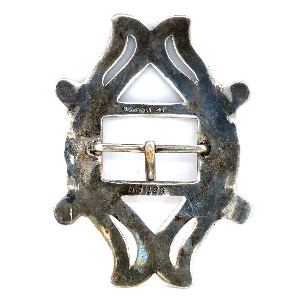 Circa 1880 Navajo Tuff Cast Belt Buckle: Circa 1880 Navajo Tuff Cast Belt Buckle Very old antique buckle sterling silver Handmade and stamped L 3" W 2 1/4 " Heavy guage fits 1" belt Navajo, S began silversmithing in the mid 1800's Mint Condi
