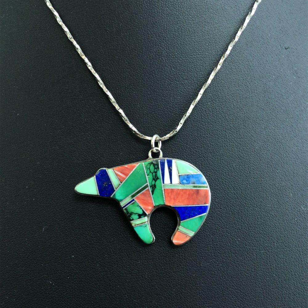 Vintage Zuni Inlay Bear Fetish Reversible Pendant: Vintage Zuni Inlay Bear Fetish Reversible unique picture graph sterling silver Pendant with Malachite, Red spiny oyster, Lapis, Turquoise and shell inlay L 1 " x W 1 5/8 " with silver chain