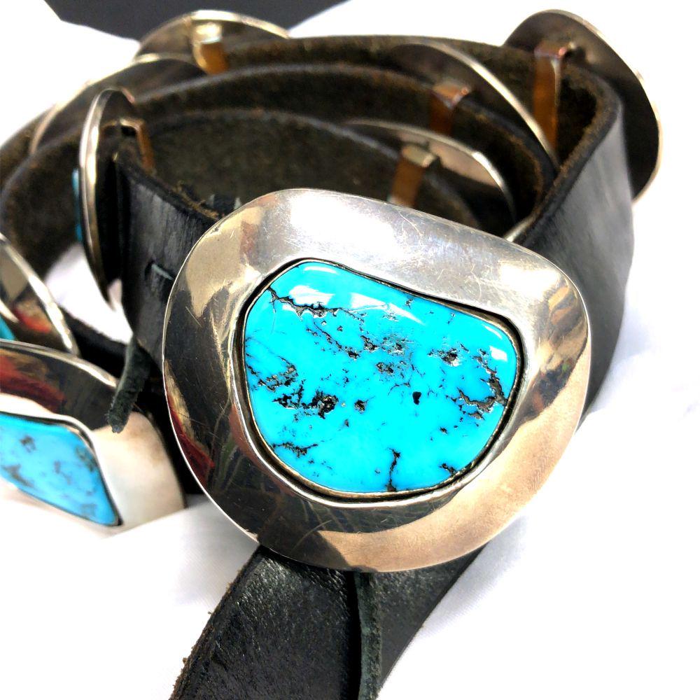 Navajo J Wright Shadow Box Turquoise Concho Belt: This is a sterling silver handmade Navajo J Wright award-winning concho belt. Taking First Place August 2012 at the Indian Market Santa Fe N.M. 1 belt buckle L 2" w 1/2" 12 conch