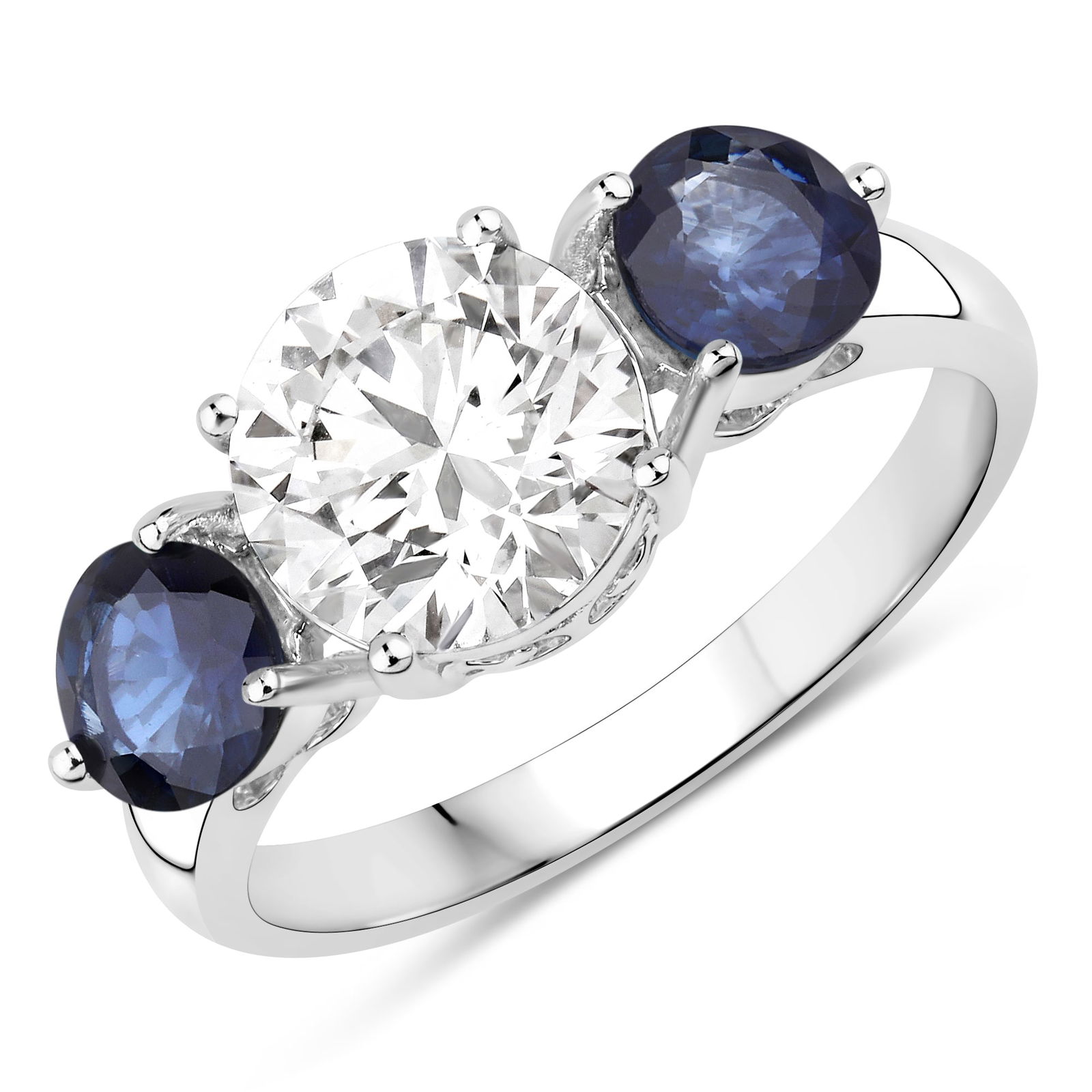 Lab Grown Diamond and Sapphire RIng: QJ8423/48-MNMT This extraordinary three-stone ring unites timeless elegance with modern brilliance. At its center shines a brilliant round-cut lab-grown diamond, radiating exceptional fire and clarit