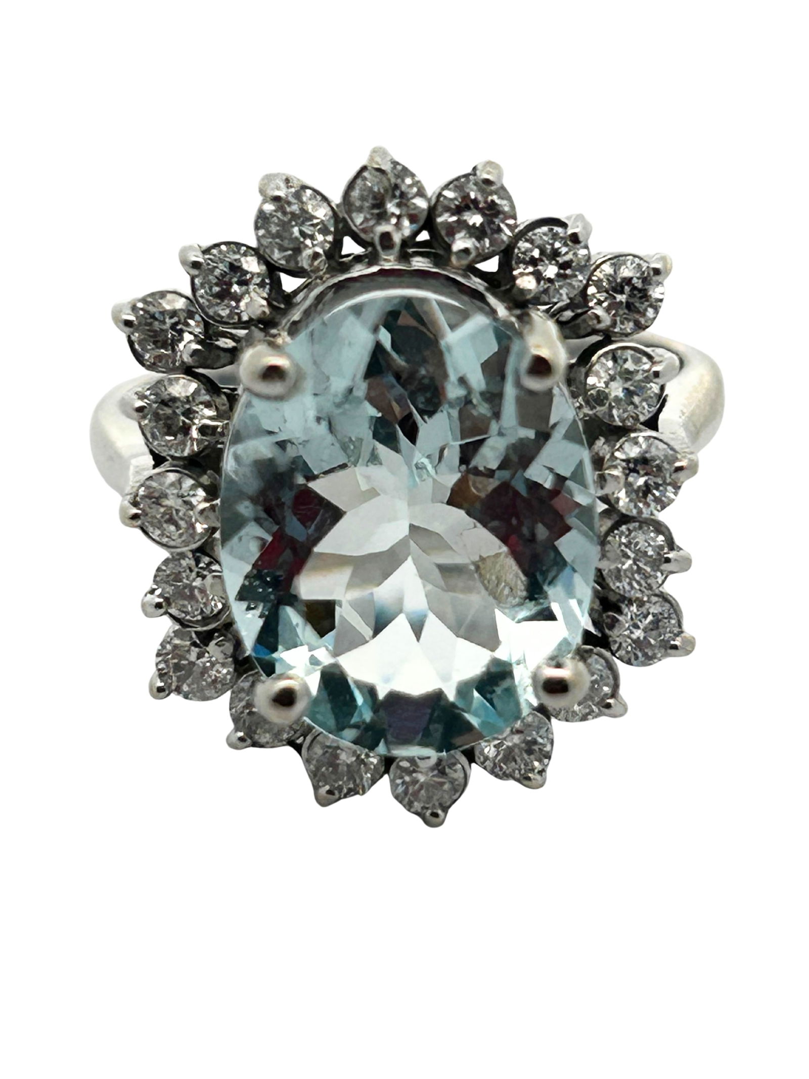 14K Aquamarine & Diamond Ring: S/5.74-MSSS This breathtaking 14K white gold ring is a true statement piece, showcasing a magnificent oval-cut aquamarine at its center. The serene, cool blue of the aquamarine is beautifully
