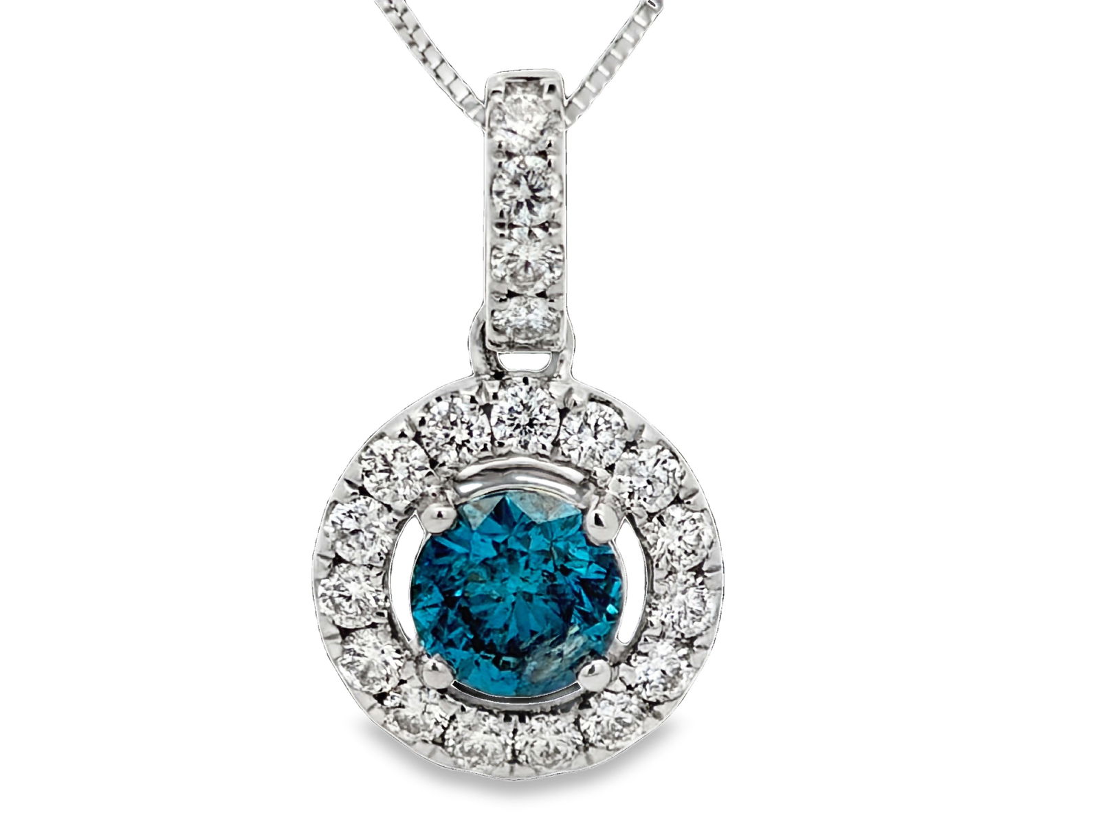 Blue Diamond Halo Pendant: MCE1003/4-MOSS Striking and elegant, this blue diamond halo pendant is crafted in polished white gold and features a vivid round blue diamond center stone secured in a four-prong setting. Surrounding