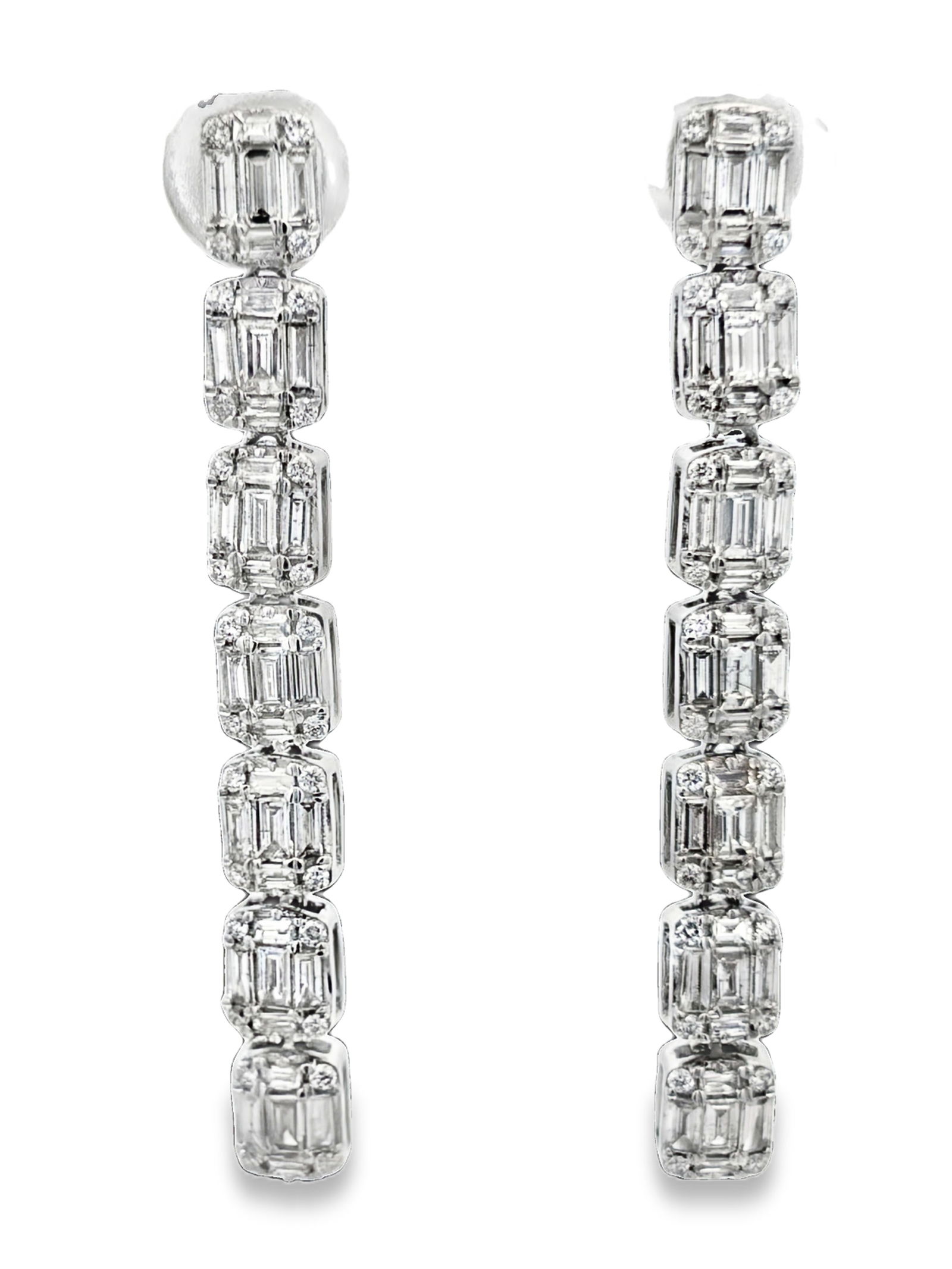 1.50 CTW Dangle Diamond Earrings: GS6259/23-MMYS A sophisticated pair of 14K Gold earrings meticulously crafted to highlight the brilliance of natural diamonds. This classic design offers a versatile silhouette suitable for