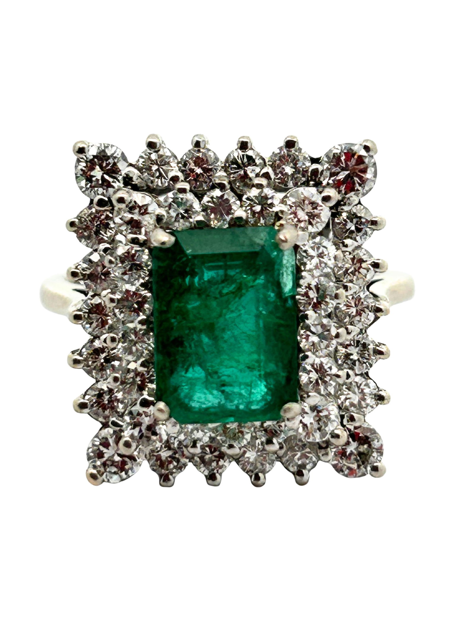 Brazilian Emerald & Diamond Cocktail Ring: S/6.8-NSSS This stunning 14K white gold cocktail ring showcases a vivid Brazilian emerald at its center, radiating a lush green hue that immediately draws the eye. Surrounding the emerald is an