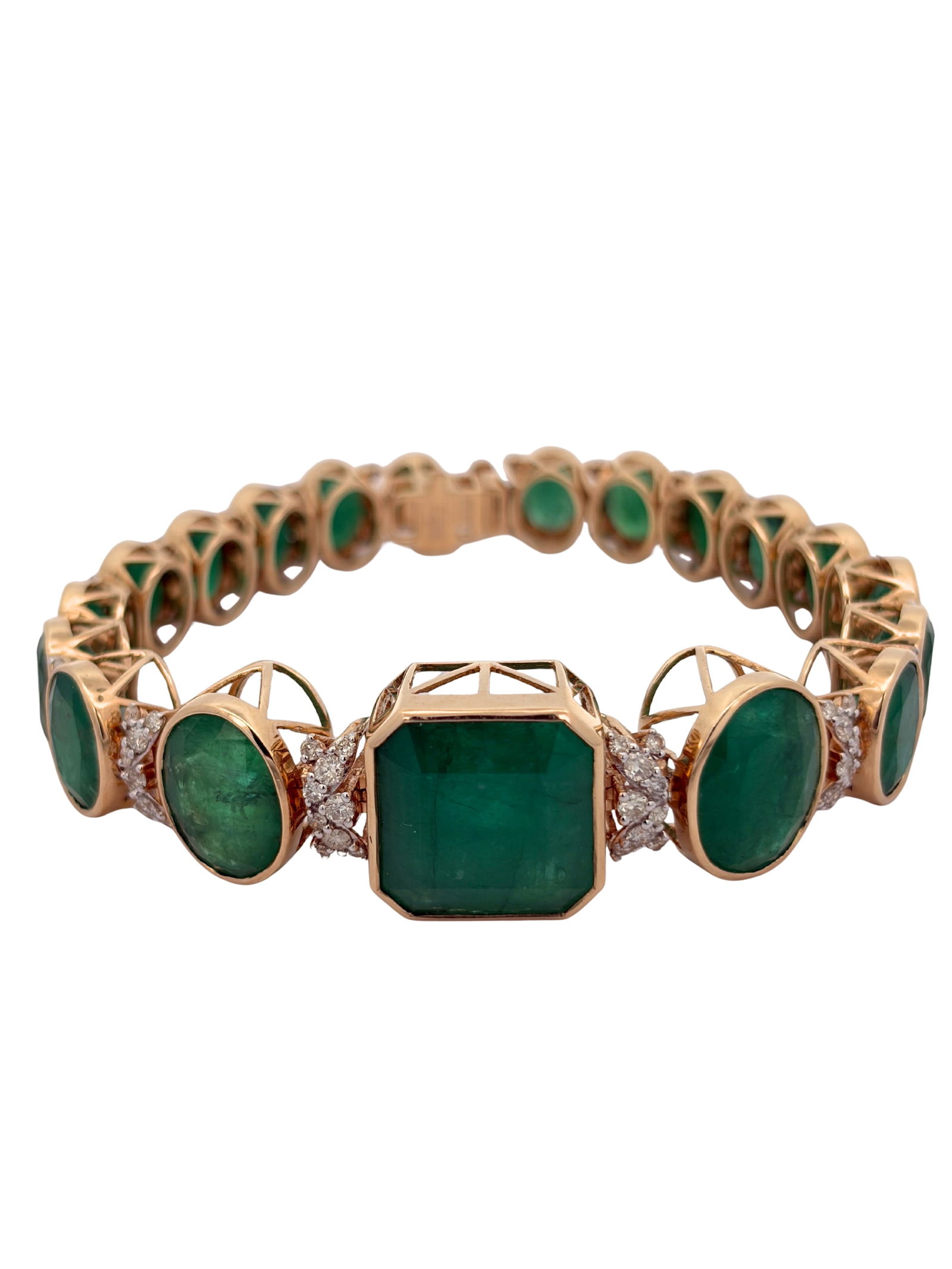 14K Emerald Bracelet: E7605/2-YNNS This magnificent 14k gold bracelet features a spectacular array of emerald-cut and oval-cut emeralds showcasing a rich, deep green hue. The design centers on a prominent emerald-cut