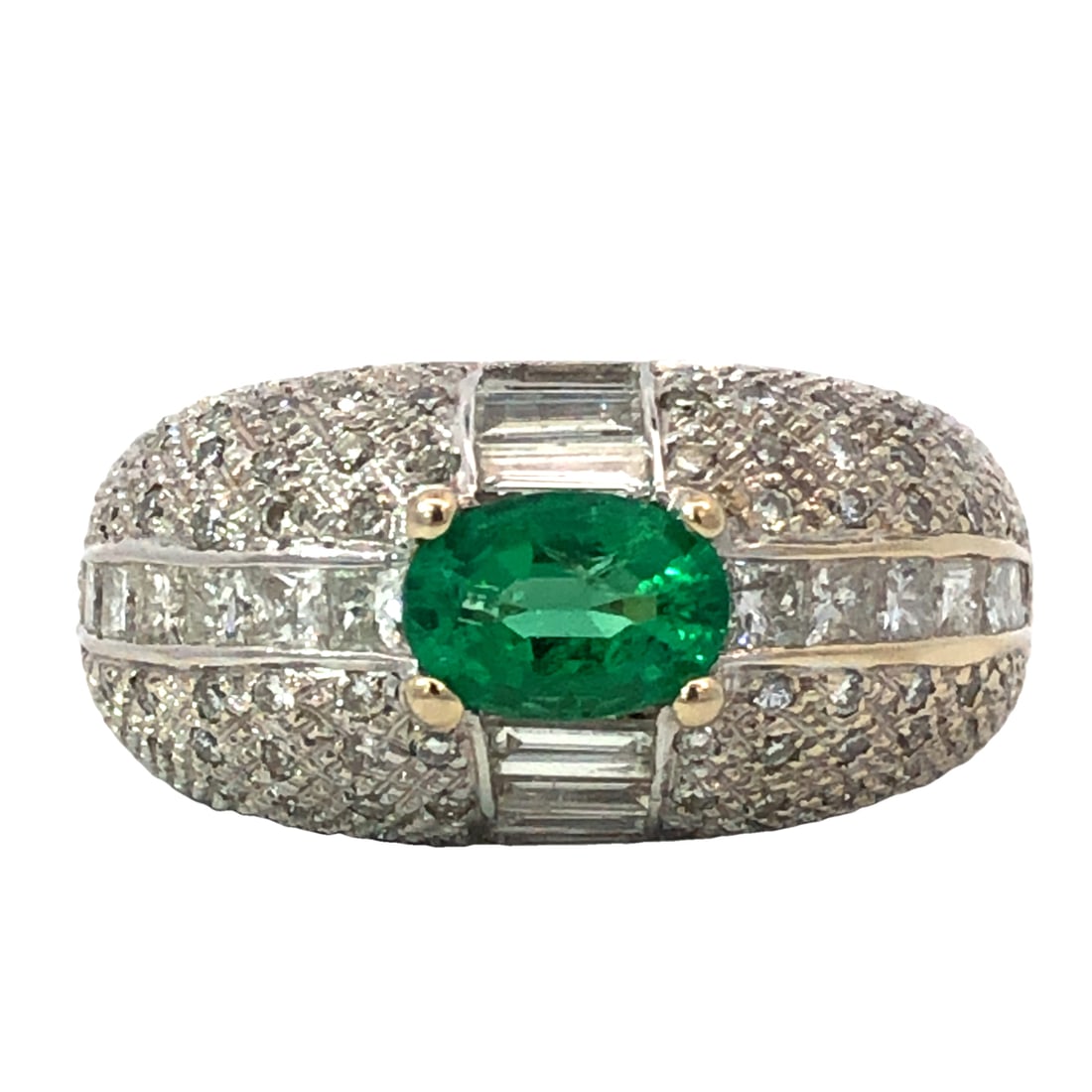 Emerald & Diamond Ring: ISL2172/55-MLLS Make a striking statement with this magnificent dome-style ring, crafted in substantial 18K white gold. The ring features a central, vivid oval-cut natural