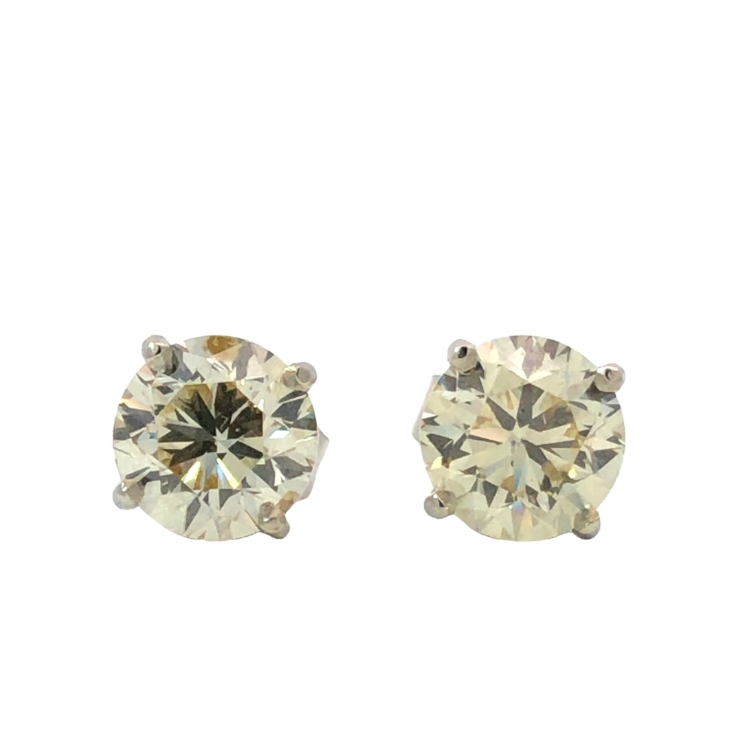 Elegant Diamond Stud Earrings: IS2172/7-MYSS This elegant pair of 14K white gold stud earrings showcases the timeless brilliance of natural round-cut diamonds. The substantial carat weight and classic design make