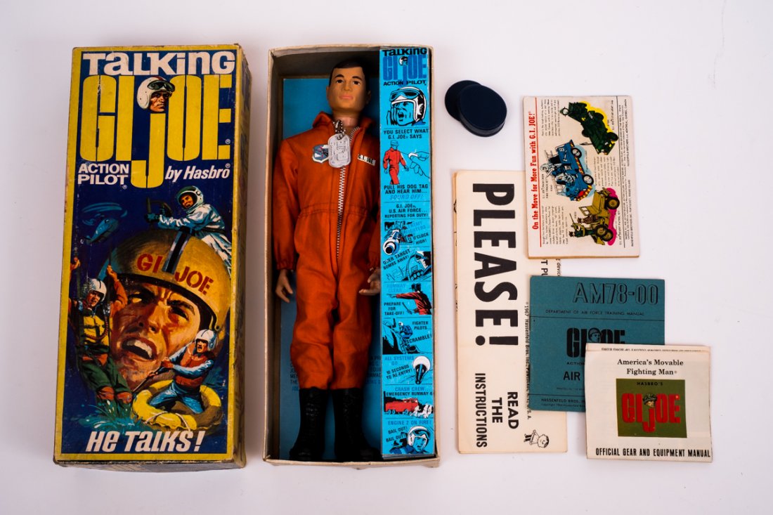 1967 Talking G.I. Joe Action Pilot in OB: DESCRIPTION: 1967 Talking G.I. Joe Action Pilot item # 7890 in original coffin box. CONDITION: Missing insignia. Stress crack to both knees.