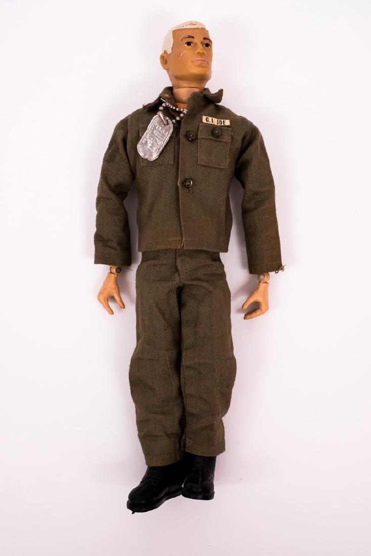 1967 Talking G.I. Joe Action Soldier: DESCRIPTION: 1967 Talking G.I. Joe Action Soldier in original outfit. CONDITION: See photos for included accessories. Stress crack to both knees.