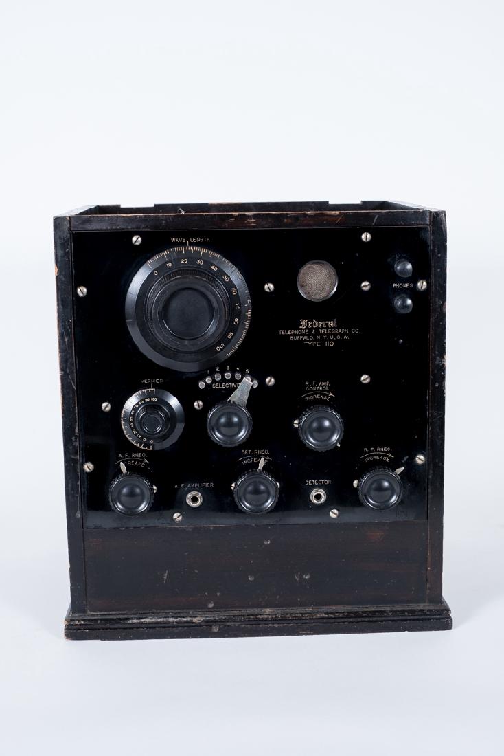 Federal Telephone & Telegraph Co 110 Receiver: DESCRIPTION: Federal Telephone & Telegraph Company Type 110 three tube receiver. MEASUREMENTS: 12-1/2" wide x 11" deep x 13-1/2" high. CONDITION: Missing lid. Case with wear.