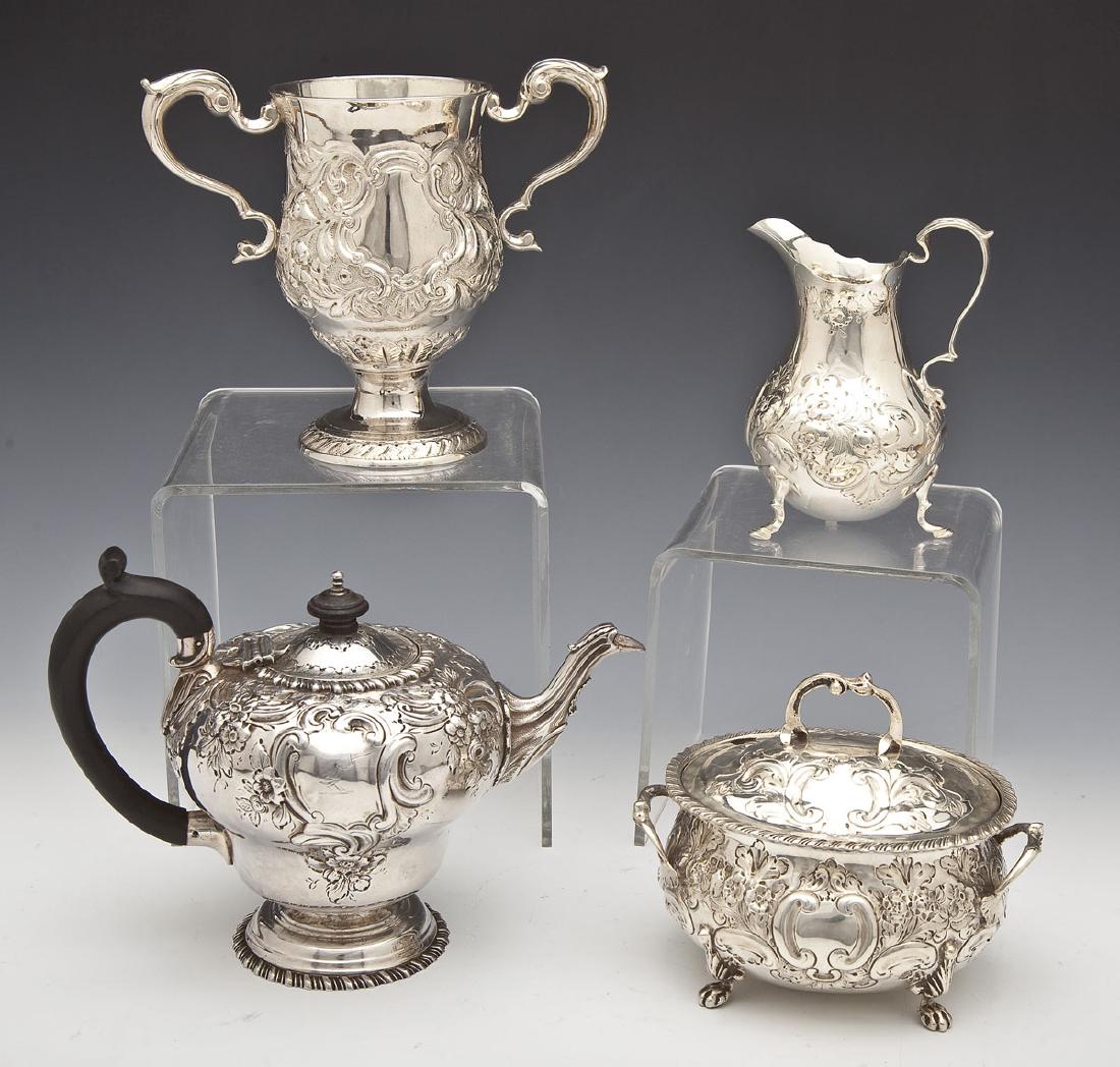 4 English & Irish Sterling Table Articles: DESCRIPTION: Four sterling table articles. Includes: 1) 5-3/4" teapot with ebony handle and knob. Hallmarked for Charles Stuart Harris, 1899. 13.1 troy ounces. 2) 4-3/4" creamer. Hallmarked for 1847 w