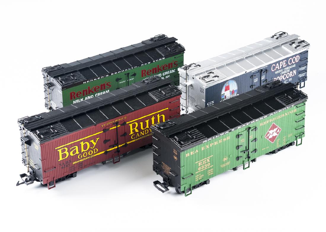 4 U.S.A. Trains Refrigerator Cars: DESCRIPTION: Four U.S.A. Trains G scale refrigerator cars. Includes Cape Cod Popcorn 16239, REA Exprees R16154, Rankins R16234, and Baby Ruth Candy. CONDITION: Each displayed. Each in original box. No