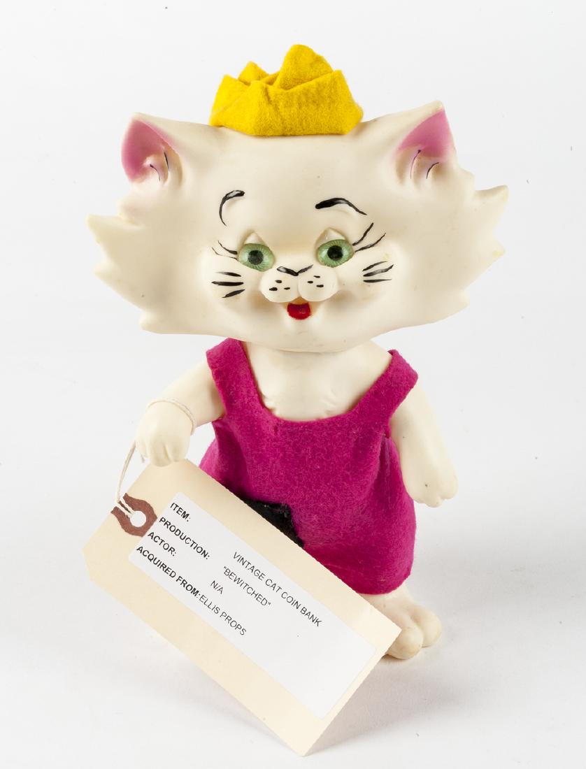 Vintage Des Rox Cat Coin Bank "Bewitched" Prop: DESCRIPTION: Vintage Des Rox cat shaped coin bank. Per information provided by the consigner, this bank was used as a prop on the set of "Bewitched" and was later sold by Ellis Props. MEASUREMENTS: 6"