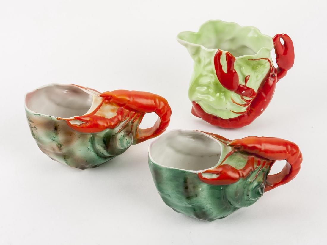 3 Royal Bayreuth Lobster Creamers: DESCRIPTION: Three Royal Bayreuth figural lobster creamers. Includes one 3-3/4" creamer marked for Royal Bayreuth and two 2-3/4" creamers. MEASUREMENTS: See Description. CONDITION: Each with minor sur