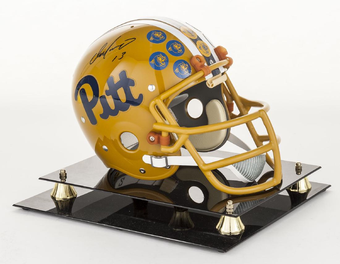 Dan Marino Signed Official Pitt Helmet with COA: DESCRIPTION: Full size Riddell Pittsburgh Panthers helmet autographed by Dan Marino. With Certificate of Authenticity from CLB Sports. In plexiglass case. MEASUREMENTS: Overall in case 12-3/4" x 14-3/