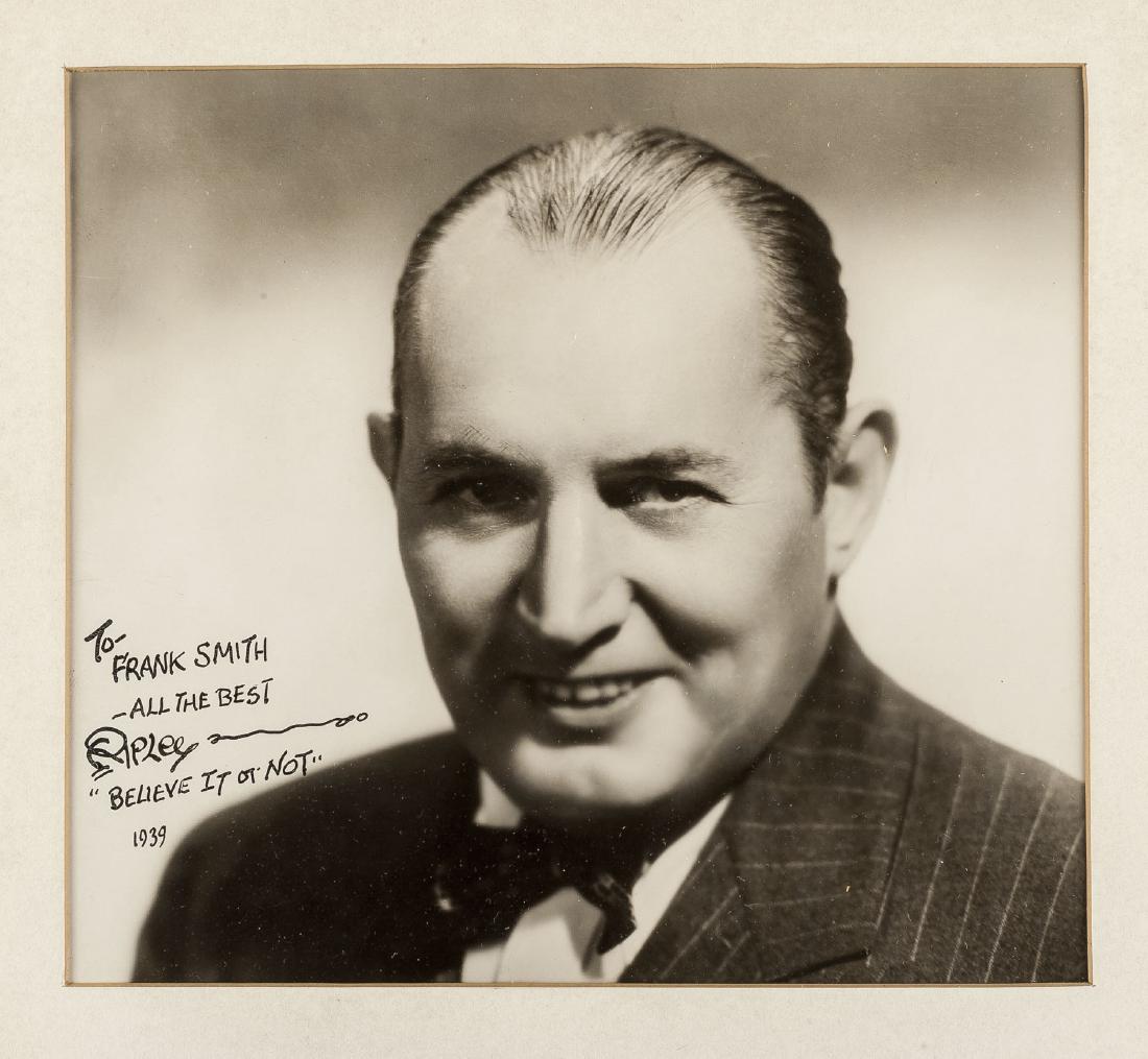 Robert Ripley Signed Photograph: DESCRIPTION: Robert Ripley signed photograph. Inscribed in black ink "To Frank Smith All the Best Ripley 'Believe it or not' 1939". Wooden frame with mat under glass. Robert L. Ripley (1890–1949) wa