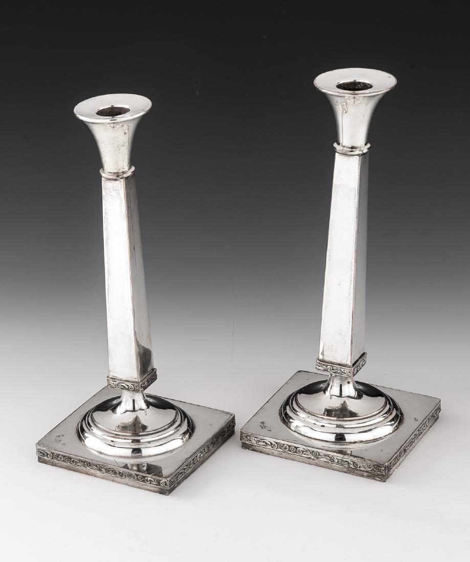 Pair of Silver on Copper Candlesticks: Pair of silver on copper candlesticks with hallmark to base . Vines and Flower Borders. 11" height.