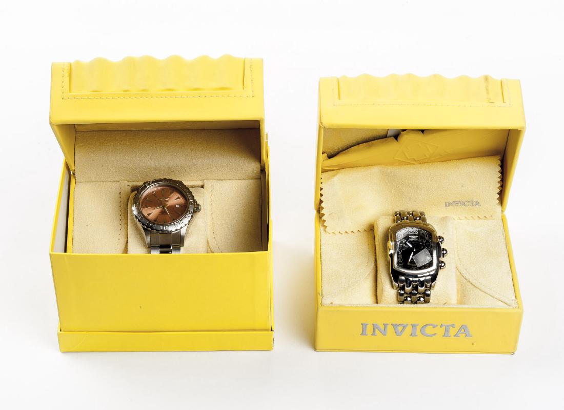 2 Invicta Wristwatches: 1) Chronograph Model 2219. "2 lug to lug. Black face. 2) Professionoal Diver Model 2302. Water resistant 200M. 2-1/4" lug to lug. Peach face. Each in original box.