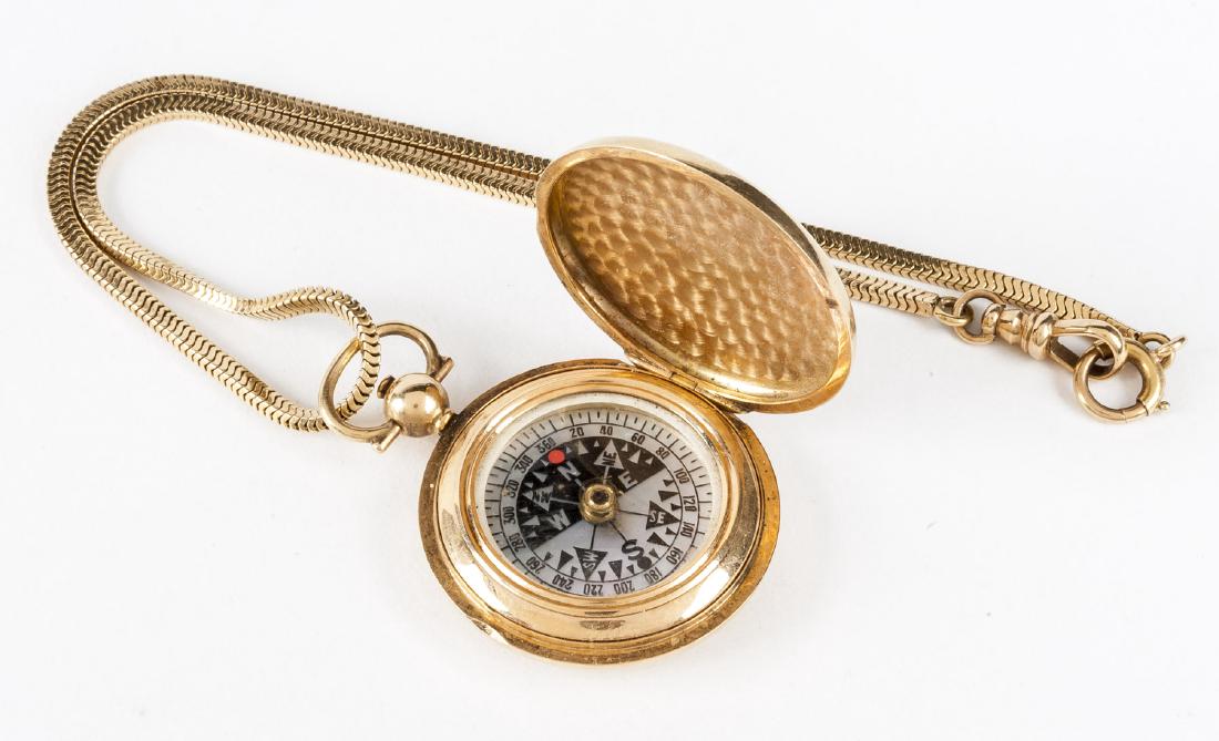14K Compass Necklace: Pendant compass, 14k (tested). Total 25.6 dwt (40 gr). On 14k stamped chain. Chain only 9 dwt (14 gr).