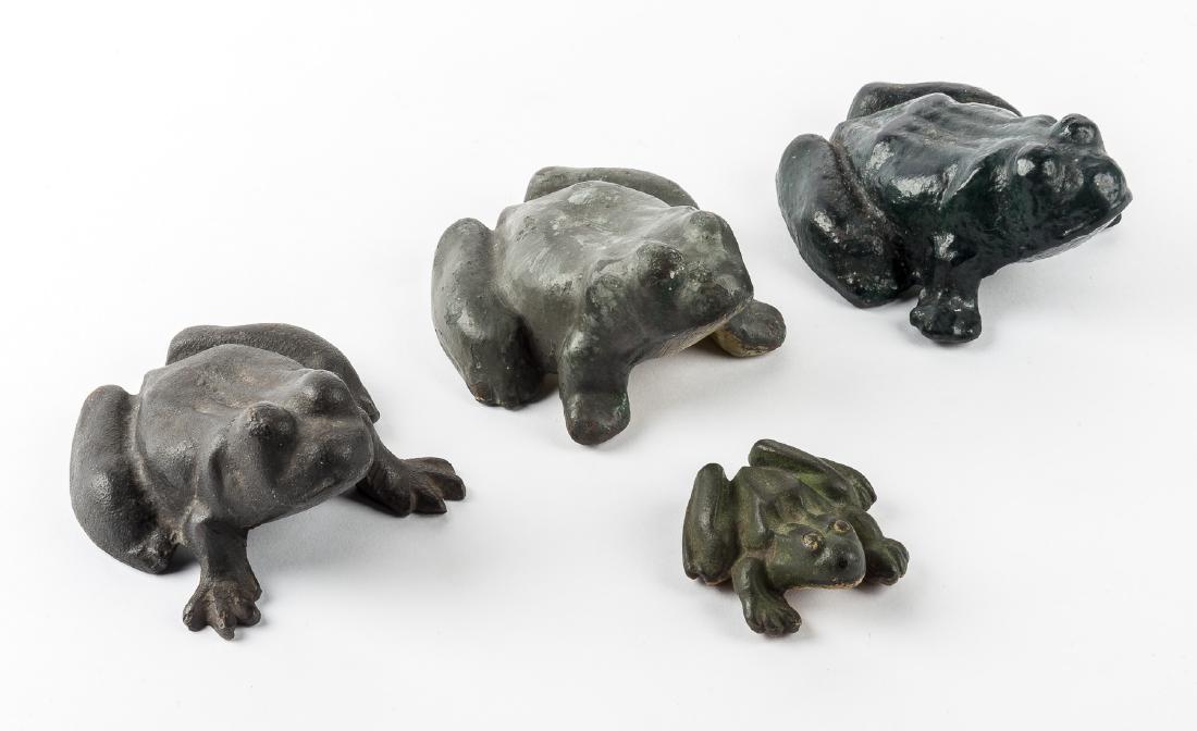 4 Cast Iron Frogs Incl Doorstops: DESCRIPTION: Four cast iron frogs. Includes three large doorstops and one small erotica frog figurine. MEASUREMENTS: Various. Range from 3" x 2-3/4" x 1-1/2" to 5-1/4" x 4-1/4" x 3-1/4". CONDITION: We
