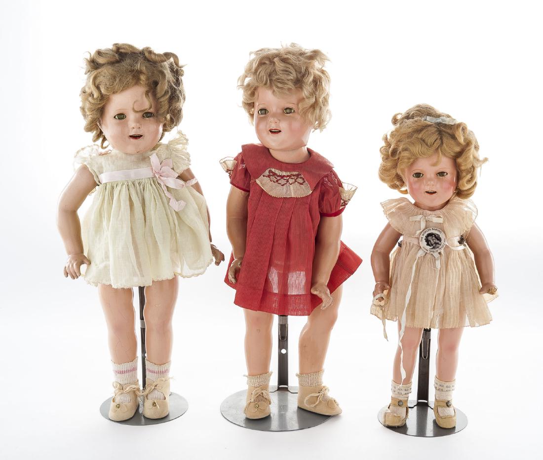 16" & Two 18" Shirley Temple Composition Dolls: DESCRIPTION: Three Ideal composition Shirley Temple dolls housed in original boxes. Sizes include one 16" and two 18" dolls. Each doll with sleepy eyes and applied lashes. Dolls with open mouth and to