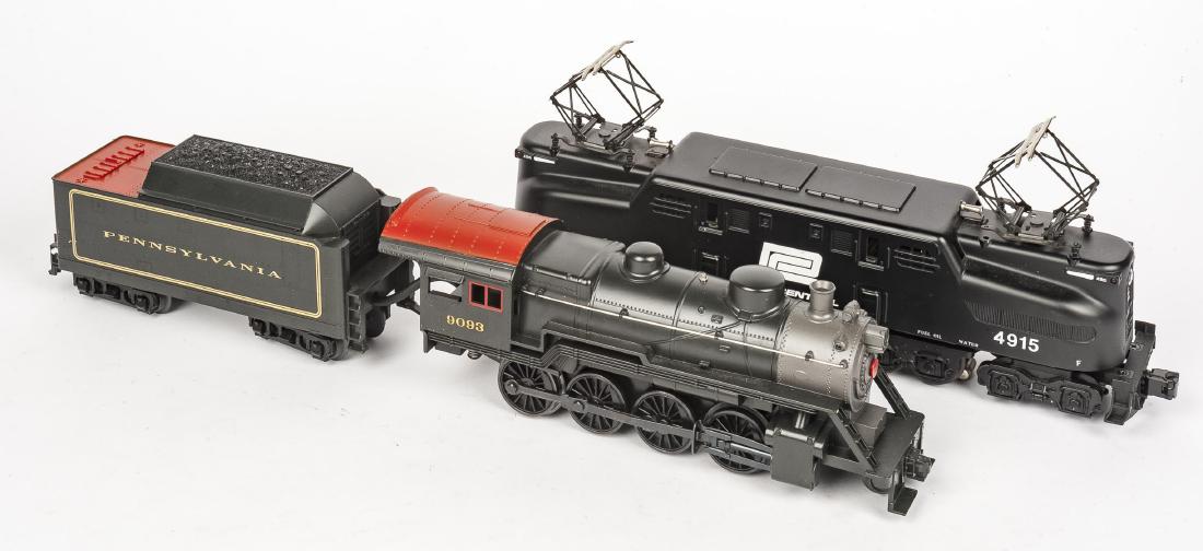 MTH O Gauge Incl PRR Steam Loco & Tender: DESCRIPTION: MTH O gauge Includes Penn Central #4915 electric locomotive and Pennsylvania #9093 steam locomotive and tender. CONDITION: Wear to trucks as expected with age and use. Penn Central locomo