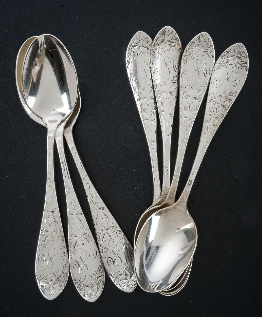 7 Hamilton & Davis Sterling Teaspoons: DESCRIPTION: Seven Hamilton & Davis sterling teaspoons with engraved florals and leaves design. Hallmarked for H&D and marked "Sterling J.C. Kelley". Monogrammed. MEASUREMENTS: 5-1/2". 5.0 troy ounces