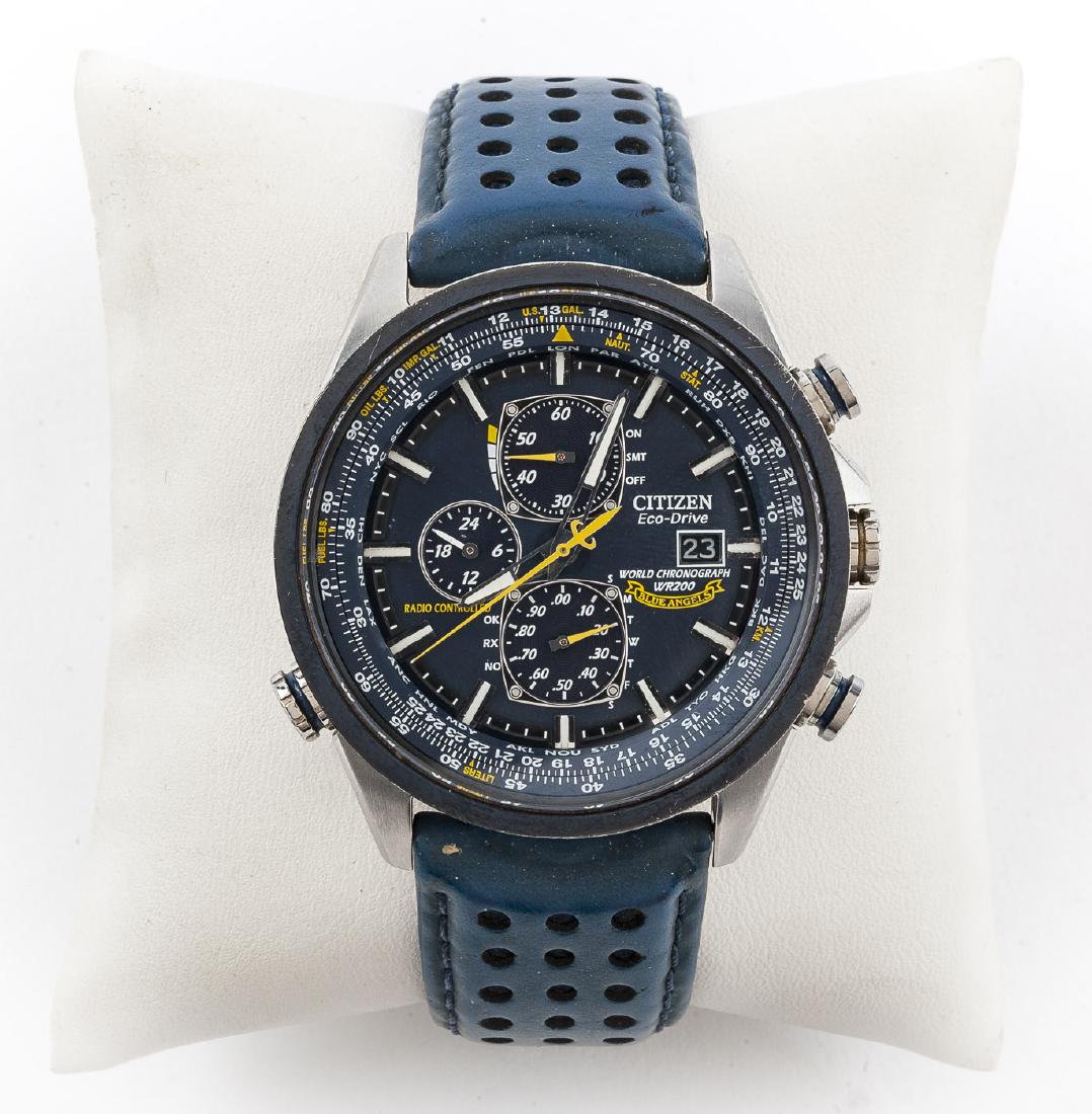 Citizen Eco-Drive Blue Angel Wristwatch: DESCRIPTION: Citizen Eco-Drive, serial number 311020999. MEASUREMENTS: 2" lug to lug. 9" overall with blue leather band. CONDITION: Wear to band.