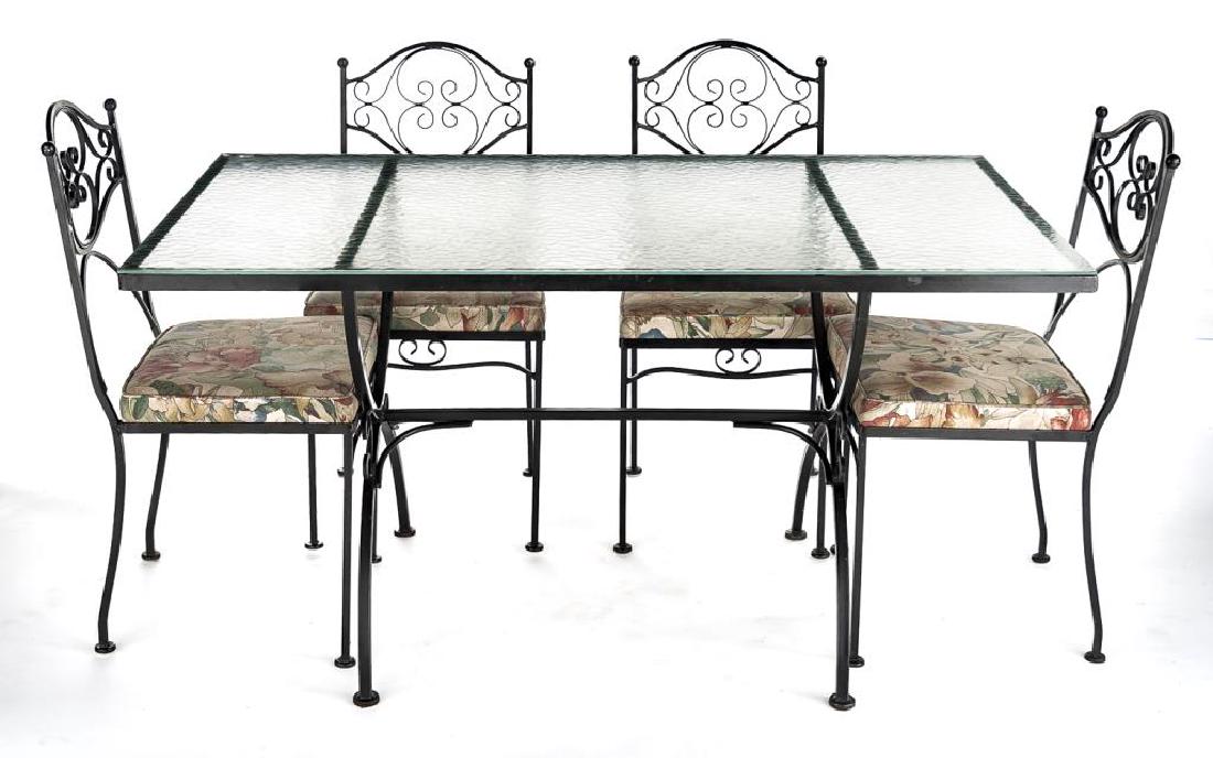 Tubular Metal Patio Dining Set: DESCRIPTION: A 1950-60s tubular metal patio set consisting of a glass top table with four accompanying chairs with removable upholstered seats. The tubular frames with floral embellishments. MEASUREME