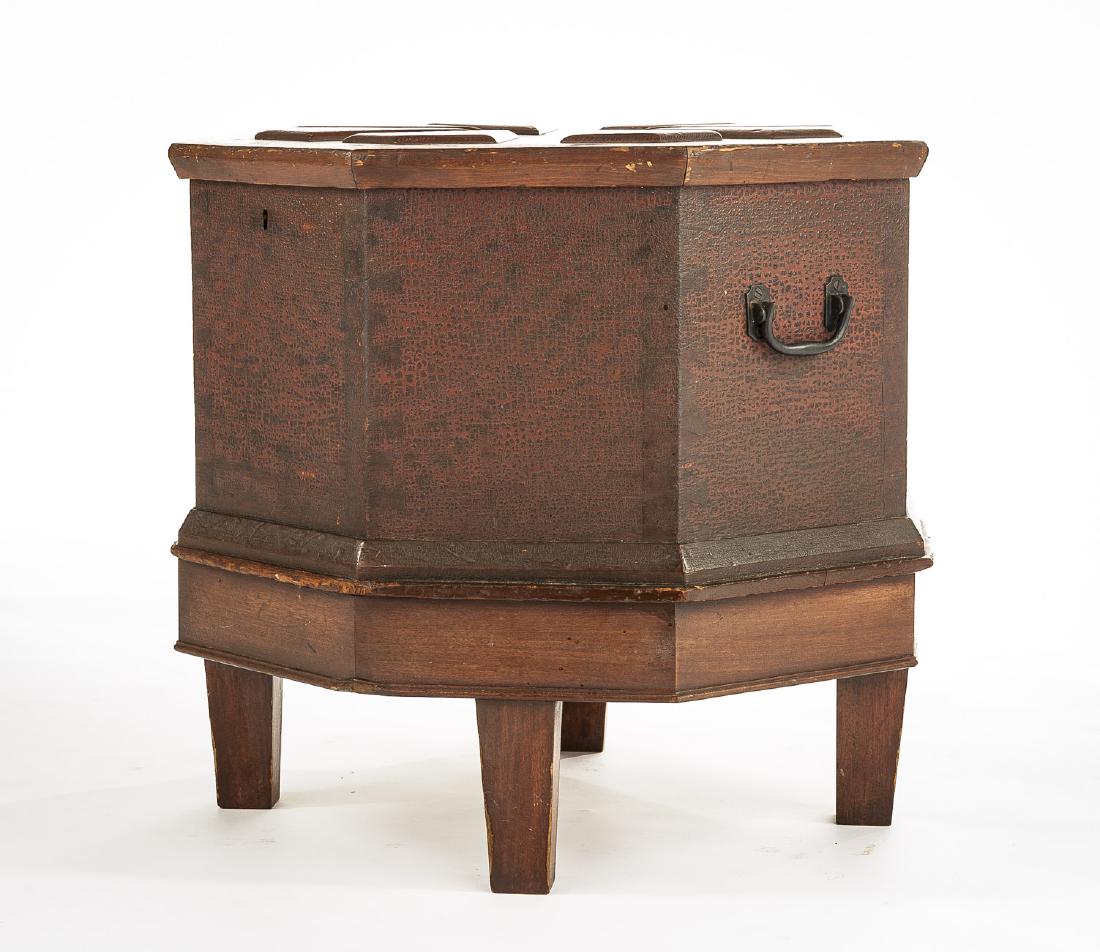 Colonial Revival Wine Cooler: DESCRIPTION: Colonial Revival mixed wood wine cooler or cellerette. Early 20th century. Form consisting of short legs, octagonal wooden cooler and matching paneled top. MEASUREMENTS: 18-3/4” wide x 