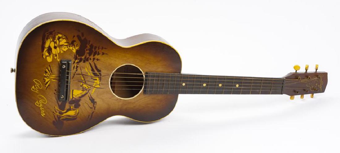 Roy Rogers Guitar in OB: DESCRIPTION: U.S. Made Roy Rogers guitar in original box. Circa 1954. With painted scene of Roy and Trigger. Marked to inside " 1983H600" and " Copyright 1954 by Roy Rogers Enterprises". Includes pape