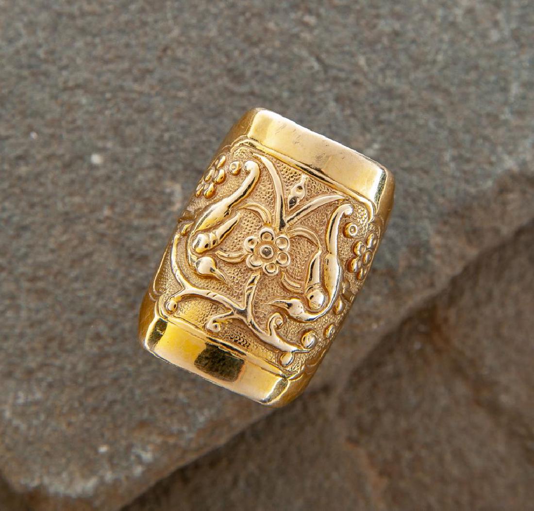 14K Art Nouveau Band Ring: DESCRIPTION: 14k ring with flower and bird design to top. Hallmark illegible. MEASUREMENTS: 7.4 dwt (11.5 grams). Size 7. CONDITION: Very light wear.
