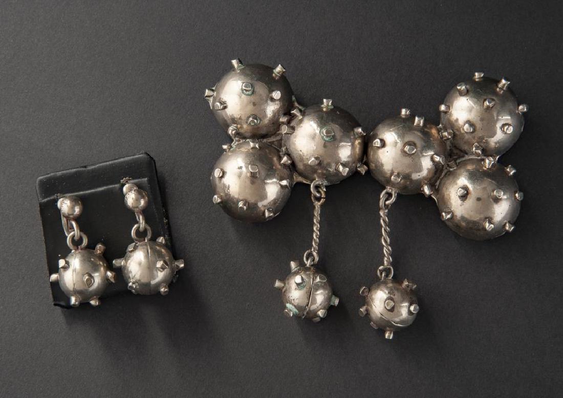 Mexican Buckle & Earrings: DESCRIPTION: Mexican buckle and earrings. Two-part buckle stamped "Mexico C.F. Retancourt" with matching screwback earrings. MEASUREMENTS: Buckle 4-1/2" x 4", Earrings 1-1/2". CONDITION: Light wear.