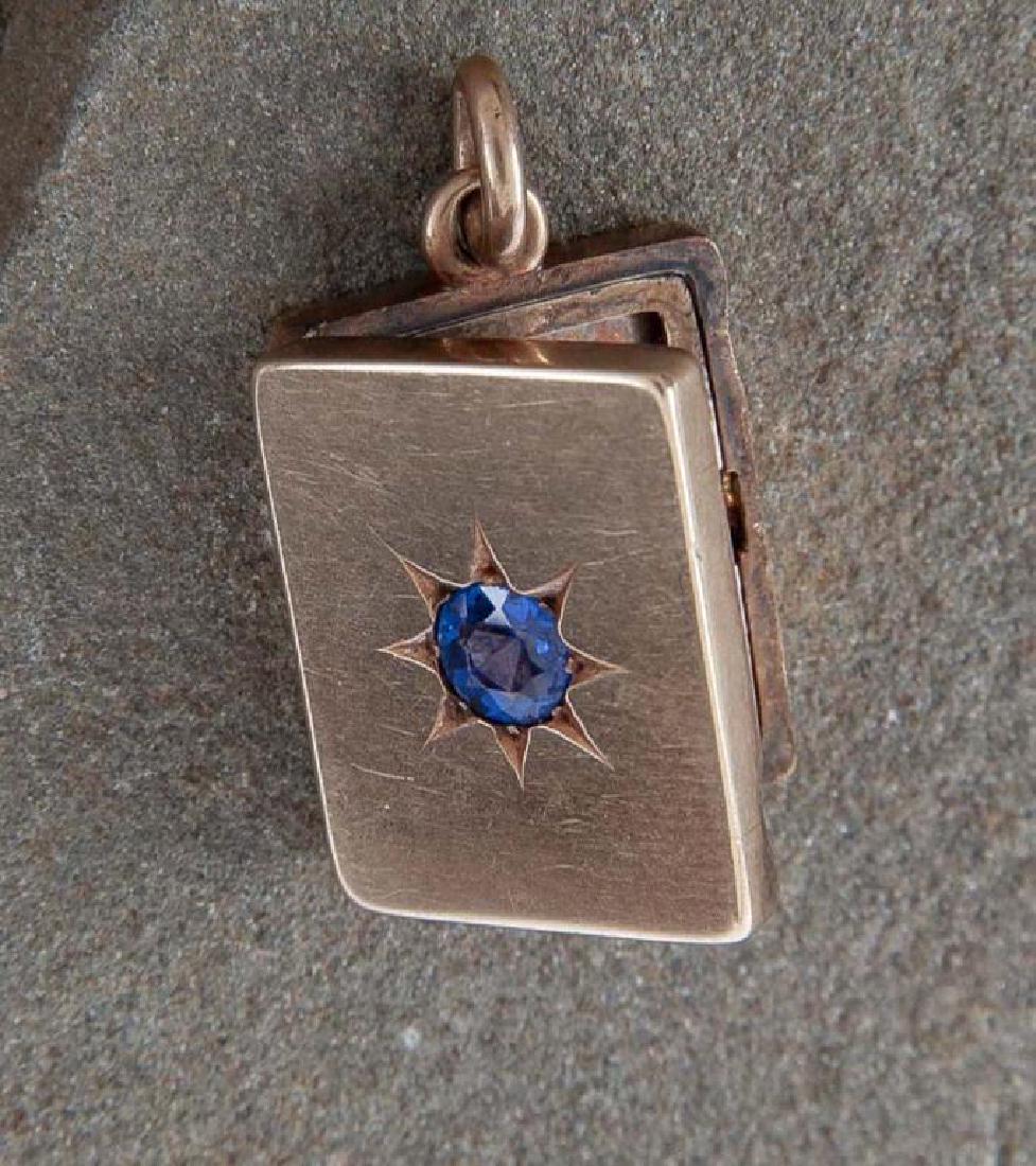 14K Locket Fob: DESCRIPTION: 14K locket / watch fob with garnet and glass doublet. MEASUREMENTS: 6.7 dwt (10.5 grams). 1" x 3/4". CONDITION: Light wear.